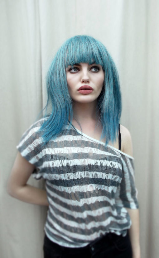 Grunge comes in washed-out muted tones of teal with hues of pale blues from roots to ends. Sleek and poker straight.