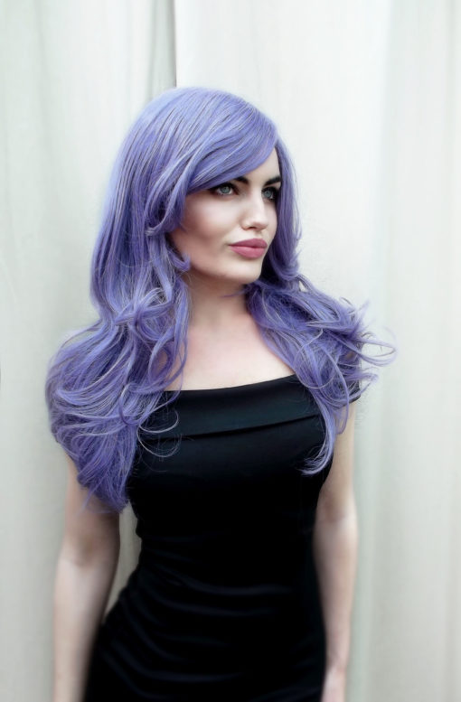 Washed up mermaid is a deep lilac colour from roots to tips. Long and luscious long layers set in loose waves that fall to the waist. The long thick fringe adds extra layers to the face.