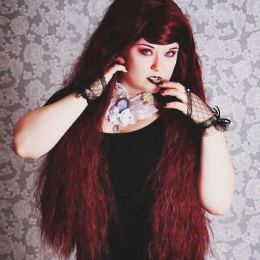So much hair! Claret is a beautiful deep red wig with plenty of volume! Boasting a waist-length crimped style, this wig is a real head turner.