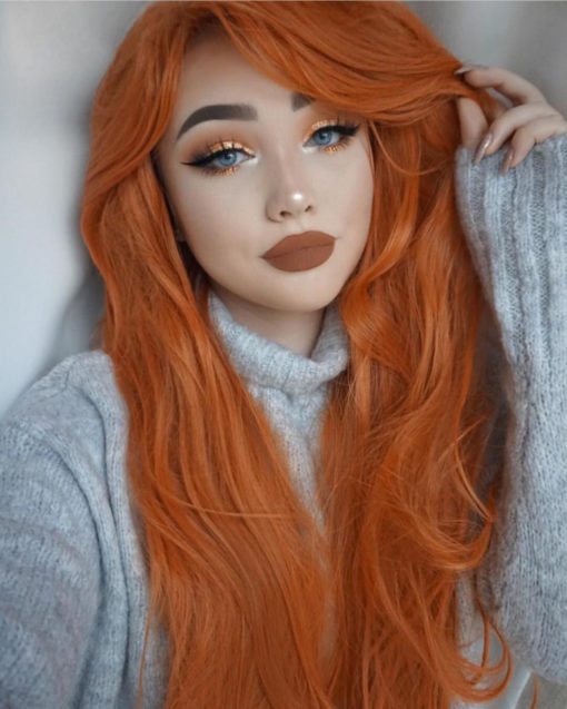 Clementine dreams is pretty and alluring with a vibrant bold orange colour from roots to tips. Long and sleek falling to the waist. With a long thick fringe that add extra layers to the face. Add your own individuality with dressing and styling.