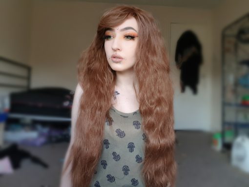 Medium brown long wig with soft waves. The waves are fairly tight, giving an almost crimped effect, but these can be brushed and softened. Natural style, with a side swept fringe. Perfect for a sweet, feminine or Mori look.