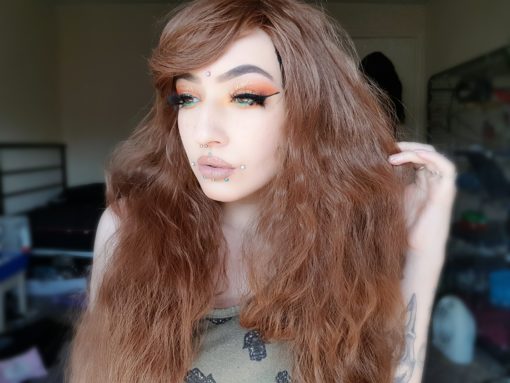 Medium brown long wig with soft waves. The waves are fairly tight, giving an almost crimped effect, but these can be brushed and softened. Natural style, with a side swept fringe. Perfect for a sweet, feminine or Mori look.