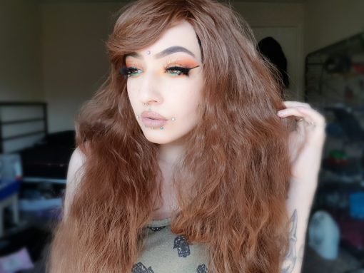 Forest Girl - Lush Wigs UK Medium brown long wig with soft waves. The waves are fairly tight, giving an almost crimped effect, but these can be brushed and softened. Natural style, with a side swept fringe. Perfect for a sweet, feminine or Mori look.