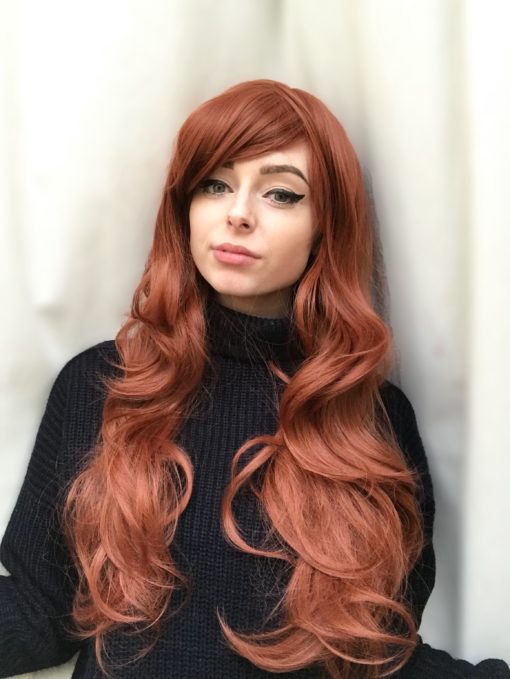 Auburn curly long wig with bangs. Looking for a classic blow-out style? Gold is taking us back in time with natural, spicy auburn shades. It's sleek invisible layers, and long fringe generate an illusion of fullness.