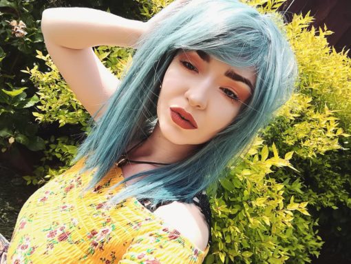 Green and blue long straight wig with bangs. Grunge comes in washed-out muted tones of teal with hues of pale blues from roots to ends. Sleek and poker straight.