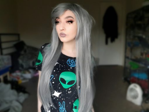 Grey long straight wig with bangs. Nannette is perfect for creating ethereal and dreamy looks. A light grey shade Long and sleek.