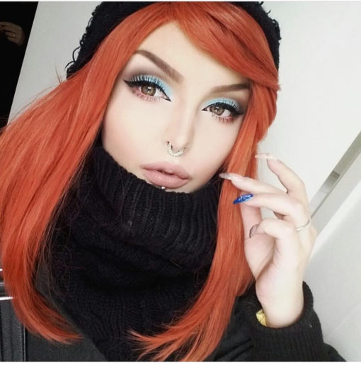 Orange long straight wig with fringe. A firm favourite of the spicy tones we have. Pumpkinhead is a muted sleek ginger that doesn't fade with time.