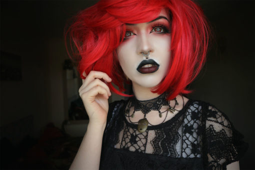 Red straight bob wig with bangs. Red Head delivers a vibrant pillar box red from roots to tips. This subtly graduated bob easily builds body, a long fringe to add layers to frame the face. Falling just to the jawline.