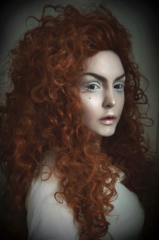 Big bright orange curly wig. Merida is in a league of its own! It is a tumbling mass of auburn set in tight ringlet curls. Naturally, as the name suggests, instant Princess Merida Brave vibes!