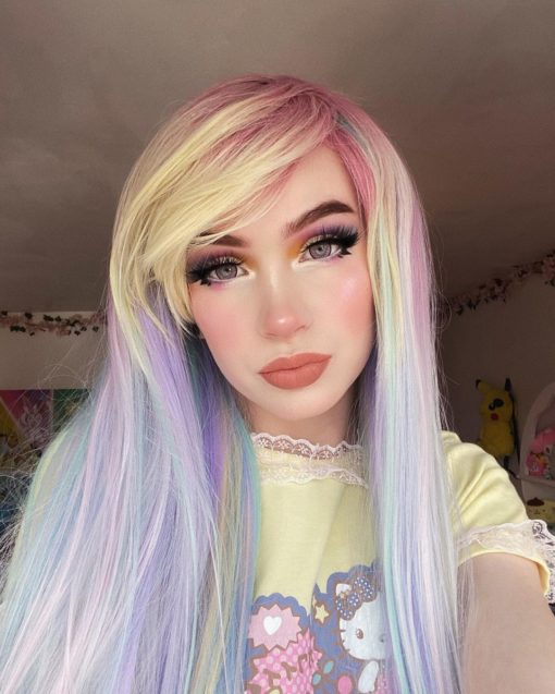 Sherbet Dip has a mixture of pastel colours that make this multi-colour wig. Pink roots melt into a mint green, blue, lilac and yellow blonde. Long and sleek with invisible layers for texture. The fringe is long and thick, wear it swept to the side or parted for long curtain bangs.