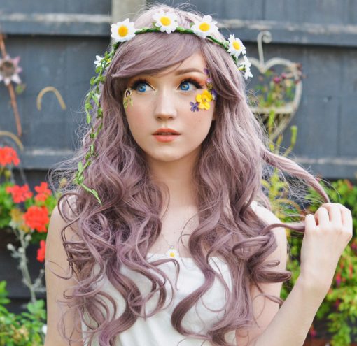We got a sweet and unique style thats, Tarot. A mix of dusky purple and mauve hues in loose barrel curls.