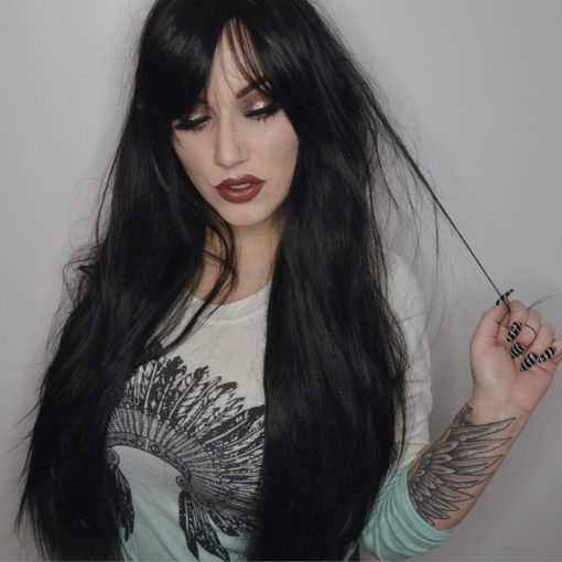 The Dark is the ultimate in Goth glamour. Jet black, with a long fringe that can be worn either parted or swept to the side. It is poker straight and at 80cm it reaches waist-length. The ultimate dramatic statement for your hair!