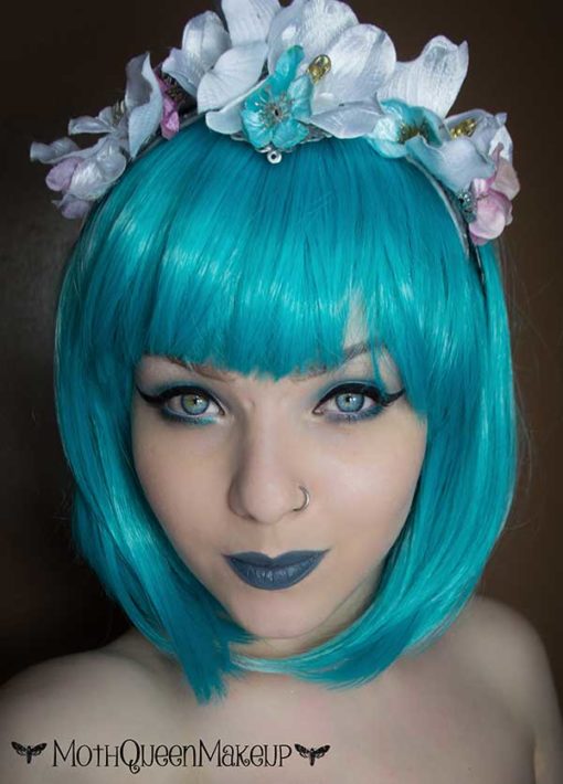 Duckling - Lush Wigs UK Cute green blue straight bob with fringe wig. You want a vibrant colour with a no fuss style? Then Duckling brings us this aqua green and blue colour mix in a sleek graduated bob.