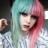 Candy split takes on the dramatic colour divide. With super cute pastel pink and green, the green melts into a faded fern tone on the ends. Split down the centre parting that carries the colour through the fringe. Sleek from the roots with a blow dry curl at the ends.