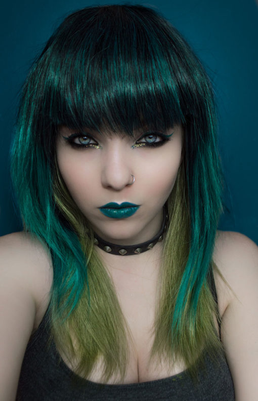 A cool mix of greens and choppy layers makes this a highly unusual and surprisingly natural feeling wig.