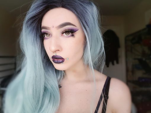 Pastel green long lace front wig. Looking for that ice queen look? Fortune Teller has black roots that blend into a mix of minty pastel green and silver tones. Sleek layered hair with a barely-there wave.