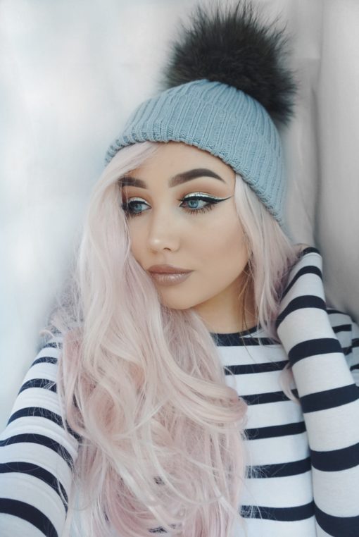 Empress combines glamour with cute. A natural twist of black roots that fade into a pastel pink hue. Full of volume from the roots, styled in big bouncy curls.