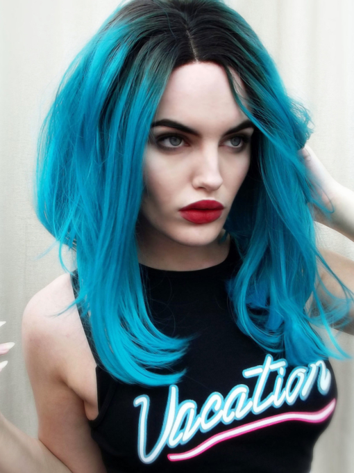 Blue straight long bob lace front wig. Make an impact in Neptune, this bright electric blue colour. Cut in a graduated sleek bob with a natural twist of black roots.