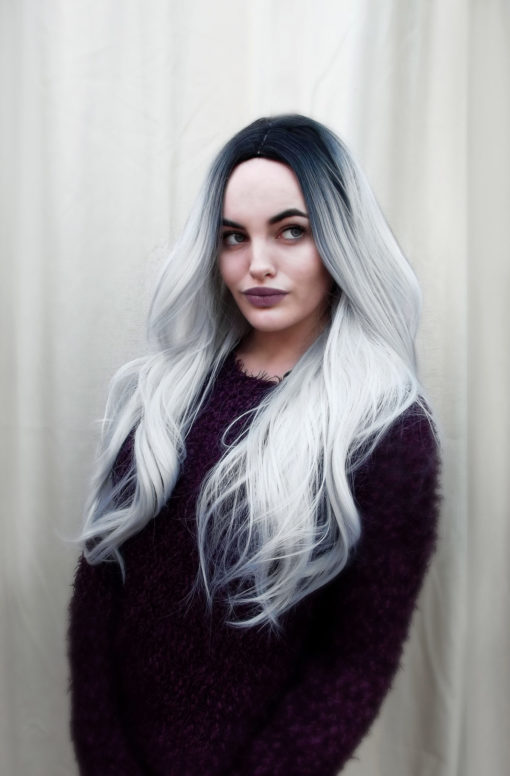A long, wavy style with a glamorous silvery-grey dip-dye. The dark roots give this wig a natural look, and the hair is thick and luxurious.