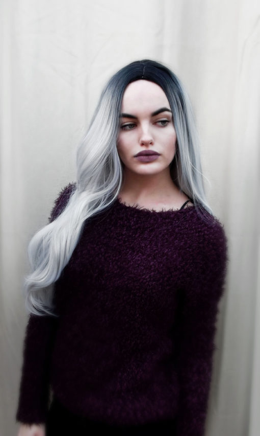A long, wavy style with a glamorous silvery-grey dip-dye. The dark roots give this wig a natural look, and the hair is thick and luxurious.