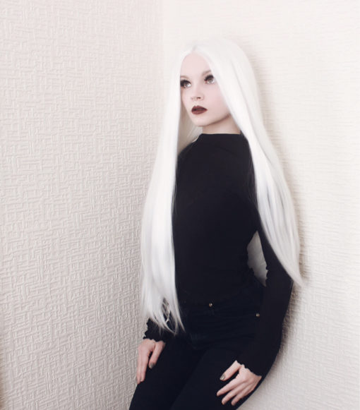 Bright, pure white lace front wig that falls sleek and straight past the bust.