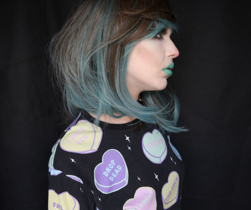 Blue and brown long bob wig. Debaser is a grungy lob, the brunette tone has 90s style slices of blue/green that frame the face.