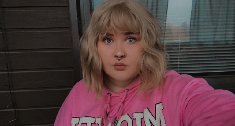 This bob is styled into loose tousled waves with plenty of volume. A light blonde shade from roots to tips. With a sleek blunt fringe 