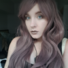 We got a sweet and unique style thats, Tarot. A mix of dusky purple and mauve hues in loose barrel curls.