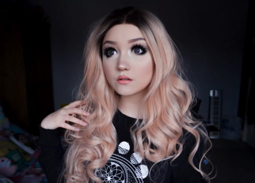 Camisole combines glamour with cute. Cool black roots fade into this pastel peach ombre. A lace front for a realistic hairline. Full of volume from the roots, styled in big bouncy curls that fall to the waist. Many ways to dress the locks into different styles.