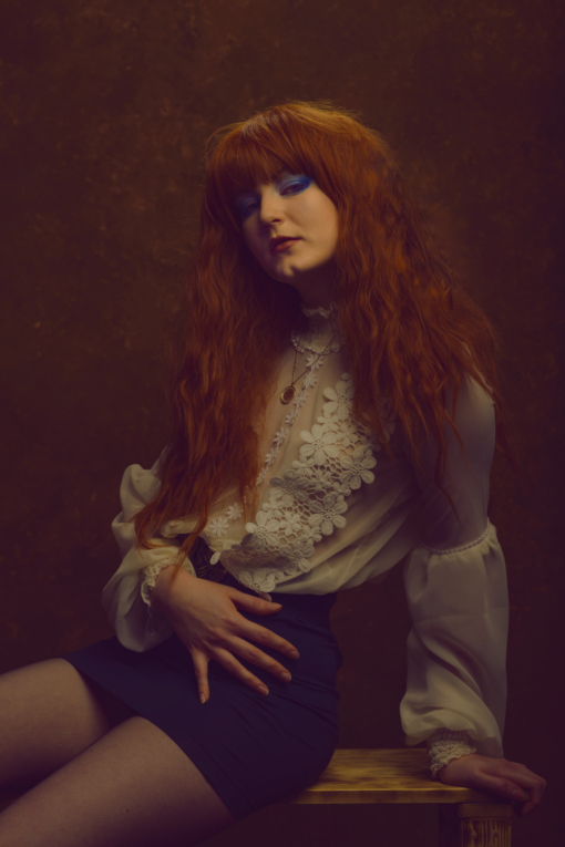 Want the sunset to reflect in your hair, then Marmalade got it covered. Spicy orange tones in loose crimped waves that fall to the waist, with a full fringe to frame the face.