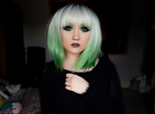 Zinnia is a beautiful mix of green and white! Icy white for the top layer, cut in a shaggy long bob with blunt, wispy fringe. The layered style allows the bright green bottom layer to peep through, creating a striking mix.