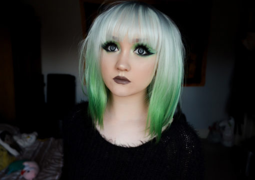 Zinnia is a beautiful mix of green and white! Icy white for the top layer, cut in a shaggy long bob with blunt, wispy fringe. The layered style allows the bright green bottom layer to peep through, creating a striking mix.