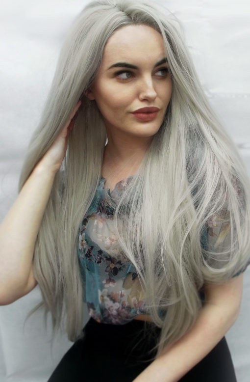 Light grey long straight lace front wig. Pale and interesting is Ghost. Light silver grey shades with smoky lowlights, with volume throughout.