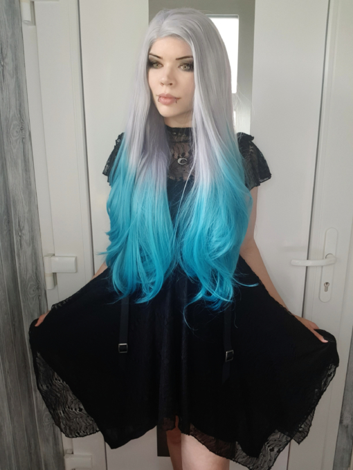 Silver blue long lace front wig. Looking for a unique play on colour? Then Deja Blue with its platinum tone that blends into an aqua/blue ombre. The style is sleek with barely-there waves.