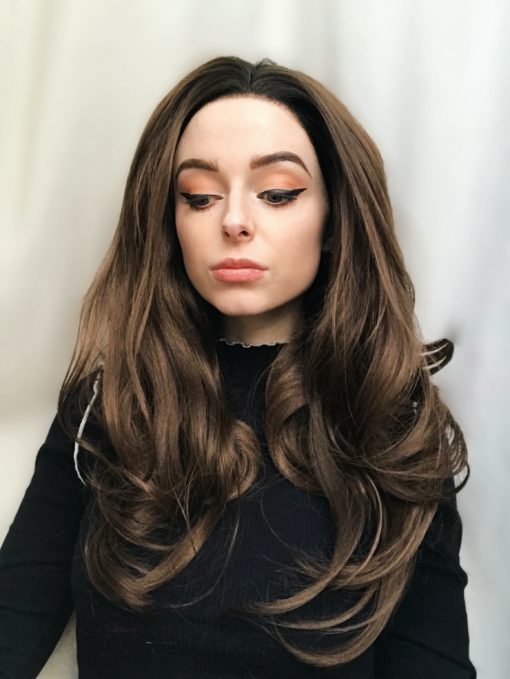 Long natural wavy lace front wig. Grace is perfect for those looking for a purely natural look. Long chocolate brown curls that fall just past the bust with dark brown/black roots and a realistic lace hairline make this a great choice for those who are looking for something conservative and elegant.