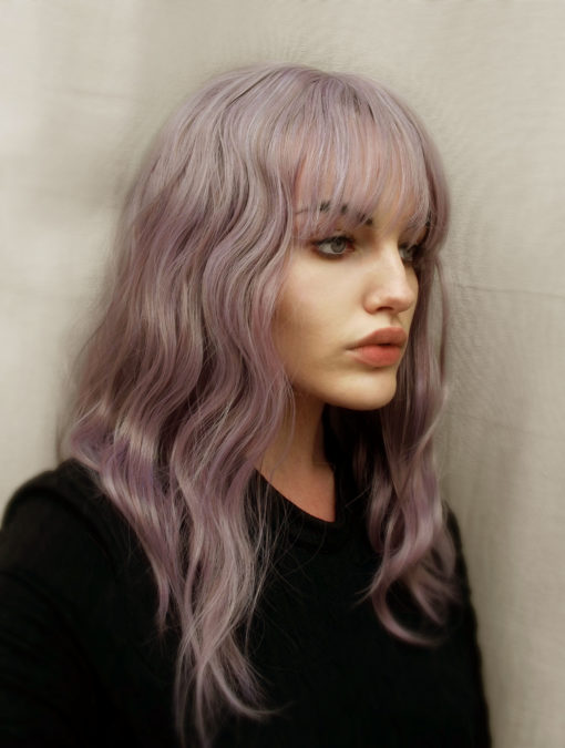 Beautiful, undone waves in a light dusky purple/mauve, Bliss is dreamy! This style falls just past the shoulder, and has a full fringe which can be trimmed blunt, or worn swept over. So pretty and an easy to maintain style, perfect for beginners and regular wearers.