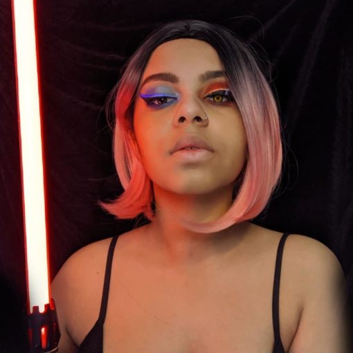 Rose pink straight bob with dark roots. XOXO takes pink hair to the next level with black shadowed roots that blend into a rose hue. As a classic chic bob, we can't get enough of it!