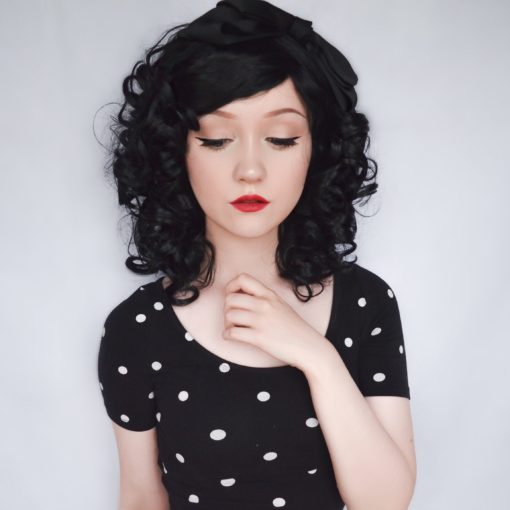 Big, bouncy jet black curls that fall just above the shoulders, Havana can be worn loose and neat or teased high and wild! No defined parting means this one is perfect for an undone curly style.