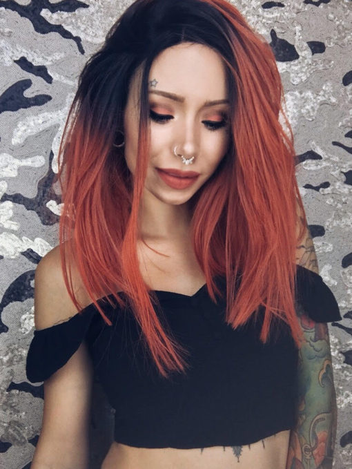 Orange straight long bob lace front wig. A bold and chic look. Valencia has cool black roots that melt into a bright burnt orange colour. A centre parting and poker straight locks.