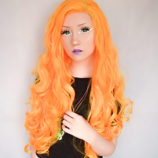 Neon bright orangey yellow, this style is not shy! This bold lace front is styled in loose curls, and can be teased for volume. Looks great with quirky make-up looks.