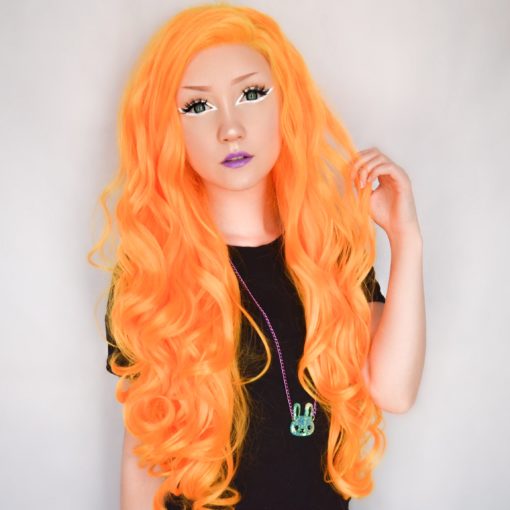 Neon bright orangey yellow, this style is not shy! This bold lace front is styled in loose curls, and can be teased for volume. Looks great with quirky make-up looks.