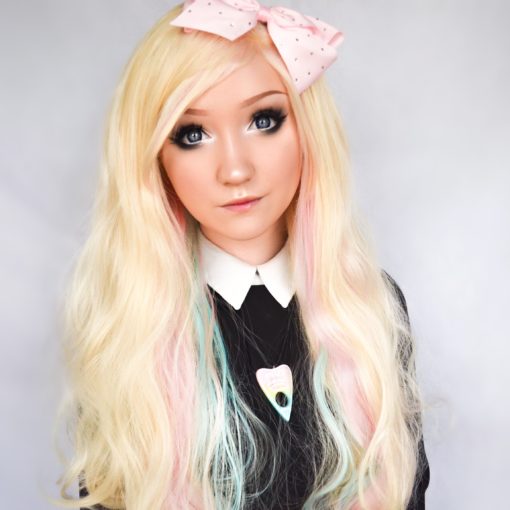 So cute! Creamy blonde lace front with rainbow pastel highlights. This quirky style is a lace front with a difference, it has a long wispy fringe that can be trimmed to suit the wearer, or swept to one side. Perfect for those who like a little forehead coverage!