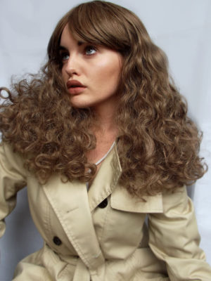 Echo - Lush Wigs UK This wig comes in a light chestnut colour from roots to tips. Lots of volume with its abundance of curls that fall just past the shoulders. A sleek full blunt fringe finishes the look.