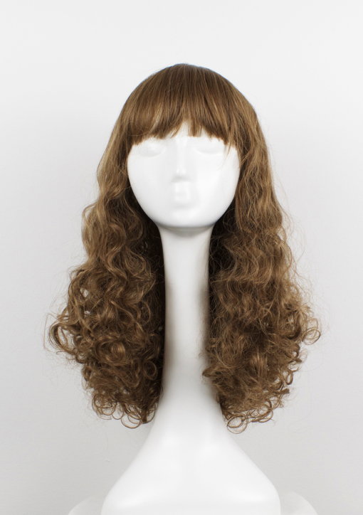 Brown curly long wig with bangs. Inspired by the 1970s disco era Echo has tight curls, curtain bangs, in a light chestnut colour. It's studio 54 again!