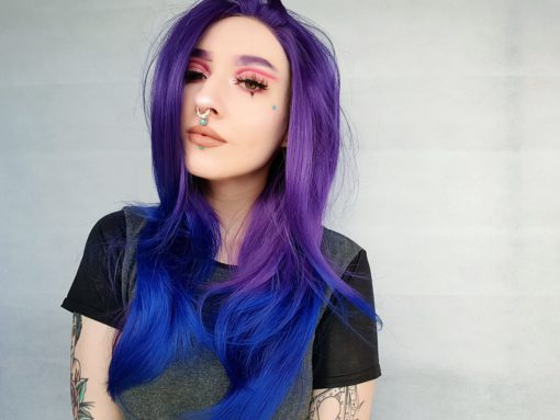 Purple and blue ombre lace front wig. Wonder is a Layered hairstyle that gives the illusion of length and volume. Dark purple from the roots and to the mid-length, then melts into a dip dye indigo blue dip-dye. Sleek and straight.