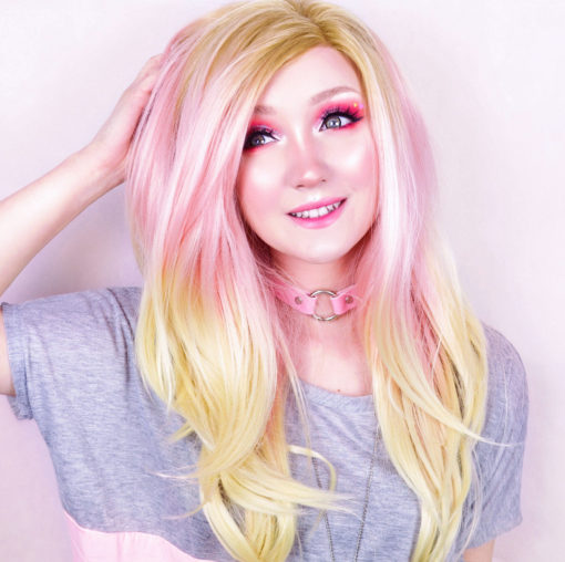Blond and pink straight lace front wig. Cupcake is pretty and feminine with the sweetest baby pink colour in the mid section, dark blonde roots and light blonde ends, long and flowing just to the waist. With layers and set in a blow out style. This is a truly unique style.