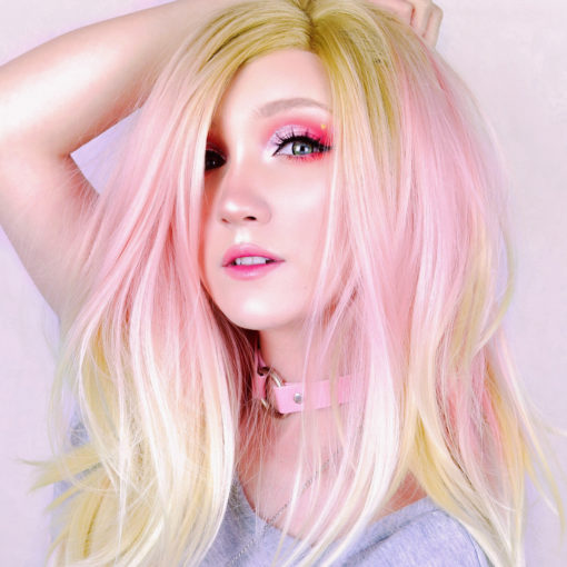 Blond and pink straight lace front wig. Cupcake is pretty and feminine with the sweetest baby pink colour in the mid section, dark blonde roots and light blonde ends, long and flowing just to the waist. With layers and set in a blow out style. This is a truly unique style.