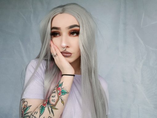 Grey straight long lace front wig. Hope is one of our very long styles that has an ethereal vibe. Sleek and pretty with a twist, a cute pop of baby pink blocks of colour along the nape of the neck. Its long lengths fall to the hips and end in a delicate wave.