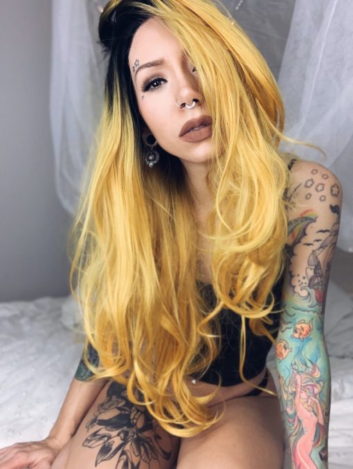 Yellow long straight lace front wig. Sunflower is Bold and beautiful. With cool black shadow roots that blend into a striking yellow blonde shade. 