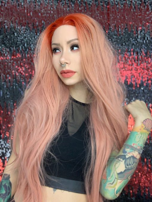 Peach long wavy lace front wig. Peach Melba takes on an unusual colour. Pretty pastel peachy lengths with a pop of orange red colour at the roots.